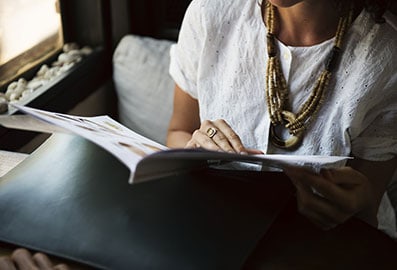 Woman reading a natural health magazine